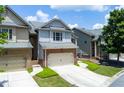 Charming brick and siding townhome with a two-car garage and well-maintained lawn at 2968 Oshields Sw Ct # 4, Marietta, GA 30060