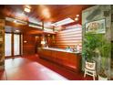 Well lit foyer with a built-in bar, stone accent walls, and unique architectural details at 2016 Castleway Ne Dr, Atlanta, GA 30345