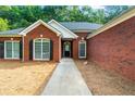 Inviting brick facade with a welcoming walkway to the front door at 7610 Golden Sands Dr, Cumming, GA 30041