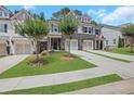 Charming townhomes feature stone accents, attached garages, and manicured front lawns at 146 Bellehaven Dr, Woodstock, GA 30188