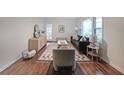Bright living room with hardwood floors, stylish furniture, and large windows allowing for natural light at 1327 Rupert Rd, Decatur, GA 30030