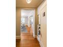 Inviting condo entrance showcasing hardwood floors and opening to the dining area and other rooms at 2 Collier Nw Rd # 5, Atlanta, GA 30309