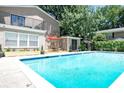 Sparkling community pool area with lounge chairs and shade, perfect for relaxation at 2232 Dunseath Nw Ave # 309, Atlanta, GA 30318