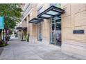 Exterior view of the building showcasing architectural details and street access at 285 Centennial Olympic Park Nw Dr # 1407, Atlanta, GA 30313
