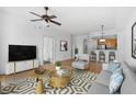 Cozy living room with an open-concept design, seamlessly connecting to the kitchen at 285 Centennial Olympic Park Nw Dr # 1407, Atlanta, GA 30313