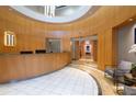 Elegant lobby area with a modern reception desk, tile flooring, and comfortable seating at 285 Centennial Olympic Park Nw Dr # 1407, Atlanta, GA 30313