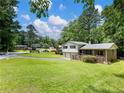 Charming two-story house with a lush lawn and mature trees at 784 San Miguel Dr, Stone Mountain, GA 30083