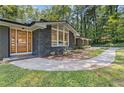 Beautifully renovated house with brick and stone exterior, manicured lawn, and an inviting front entrance at 3008 Ridgeside Ct, Atlanta, GA 30341