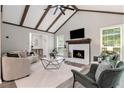 Bright living room with vaulted ceilings, fireplace, and large windows at 1575 Barrier Rd, Marietta, GA 30066