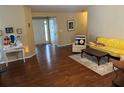 Cozy living room with hardwood floors and comfortable seating at 2256 Hansford Pass, Buford, GA 30519