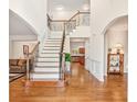 Bright foyer with hardwood floors, staircase with wrought iron railings, and high ceilings at 3065 Moser Way, Marietta, GA 30060
