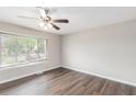 Cozy bedroom filled with natural light from a bright window and plush wood floors at 3787 Stephanie Sw Dr, Atlanta, GA 30331