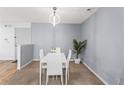 Contemporary dining area with white table set and stylish overhead lighting at 4203 Fairington Village Dr, Lithonia, GA 30038