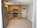 Eat-in kitchen featuring stainless steel appliances and tile flooring at 1150 Terramont Dr, Roswell, GA 30076