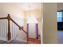 Inviting entryway with hardwood floors, a staircase, and a view into the home's interior at 9444 Lakeview Ct, Douglasville, GA 30135