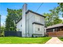 Rear view of home with gray siding and a tall chimney at 900 Ira Sw St, Atlanta, GA 30310