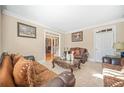 Elegant living room with neutral tones, decorative accents, and a doorway view at 1561 Annapolis Way, Grayson, GA 30017