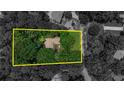 Aerial view of property, outlined in yellow, showcasing the home's setting within a lush, tree-filled landscape at 270 Hollyridge Way, Roswell, GA 30076
