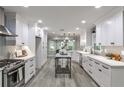 Bright, all-white kitchen featuring modern appliances, stylish countertops, and ample cabinet space at 270 Hollyridge Way, Roswell, GA 30076