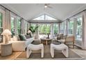 Sunlit living room with large windows, neutral decor, and comfortable seating, creating a relaxing atmosphere at 270 Hollyridge Way, Roswell, GA 30076