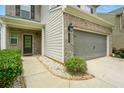 Inviting home exterior with a two-car garage and well-kept landscaping at 119 Hardy Water Dr, Lawrenceville, GA 30045