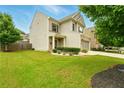 Well maintained home with green lawn, beautiful landscaping and two car garage at 119 Hardy Water Dr, Lawrenceville, GA 30045