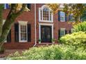 Stately front entrance with elegant double doors and decorative brickwork at 410 Beechwood Ln, Woodstock, GA 30189