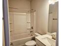 A bright bathroom with a bathtub and shower combination, complete with modern fixtures at 112 Scarlett Place Dr, Bowdon, GA 30108