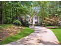 View of a charming home nestled in lush greenery, offering a private and serene setting at 4341 Horder Ct, Snellville, GA 30039