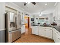 Spacious kitchen with stainless steel appliances, granite countertops and wood floors at 2505 Ridgehurst Dr, Buford, GA 30518