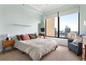 Comfortable bedroom with ample natural light and city views, enhanced by neutral decor at 3445 Stratford Rd # 3102, Atlanta, GA 30326