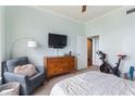 Spacious bedroom featuring modern decor, a cozy chair, and exercise equipment at 3445 Stratford Rd # 3102, Atlanta, GA 30326