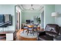 Dining room boasts a round table, four chairs, an accent rug, and access to an adjacent office at 3445 Stratford Rd # 3102, Atlanta, GA 30326