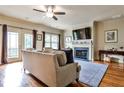Cozy living room with hardwood floors, fireplace, and access to an outdoor deck with view at 680 Emeril Dr, Avondale Estates, GA 30002