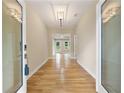 Elegant hallway with hardwood floors, modern lighting, and glass doors leading to the outdoors at 2552 Scenic S Hwy, Snellville, GA 30078