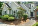 Charming home featuring mature landscaping and a covered front porch at 46 Highland Ct, Carrollton, GA 30116