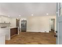 Open-concept living space with wood floors, white trim, and abundant natural light at 1364 Willis Mill Sw Rd, Atlanta, GA 30311