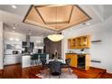 Bright, modern kitchen with stainless steel appliances, hardwood floors, and a stylish chandelier at 3334 Peachtree Ne Rd # 1707, Atlanta, GA 30326