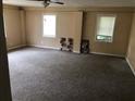 Spacious bedroom with carpet flooring, and lots of natural light at 4485 Merlin Ne Cir, Douglasville, GA 30134