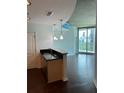 Kitchen with bar-top seating, pendant lights, and views of the city at 361 17Th Nw St # 1303, Atlanta, GA 30363