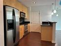 Bright kitchen with stainless steel appliances, black backsplash, and hardwood flooring at 361 17Th Nw St # 1303, Atlanta, GA 30363