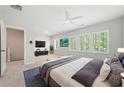 Spacious main bedroom featuring large windows, a ceiling fan, and ample natural light at 233 Retreat Ln, Canton, GA 30114