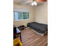 This bedroom features a window, wood flooring, and neutral paint at 405 Fairburn Sw Rd # 64, Atlanta, GA 30331