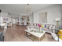 Open-concept living and dining area featuring hardwood floors and an abundance of natural light at 270 17Th Nw St # 2804, Atlanta, GA 30363