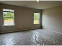 Spacious bedroom with ample natural light from two large windows at 5522 Cosimo Rd, Fairburn, GA 30213