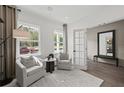 Cozy living room features neutral tones, lots of natural light and comfortable seating at 6106 Marigold Way, Atlanta, GA 30349