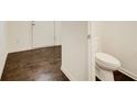 A well-maintained half bathroom with attractive wood floors and modern fixtures at 550 Constellation Overlook Sw, Atlanta, GA 30331