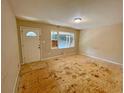 Bright living room featuring a window letting in natural light, awaiting your personal touch at 6106 Oak Hill Sw Dr, Austell, GA 30168
