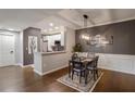 Dining room with stylish light fixture and easy access to kitchen featuring stainless steel appliances at 955 Juniper Ne St # 3331, Atlanta, GA 30309