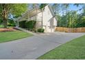 Spacious home featuring a three-car garage, long driveway and a fenced backyard at 212 Warrenton Dr, Douglasville, GA 30134